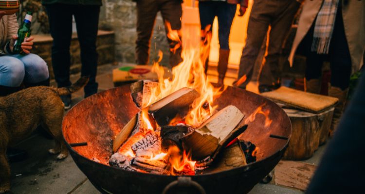 can you burn treated wood in a fire pit